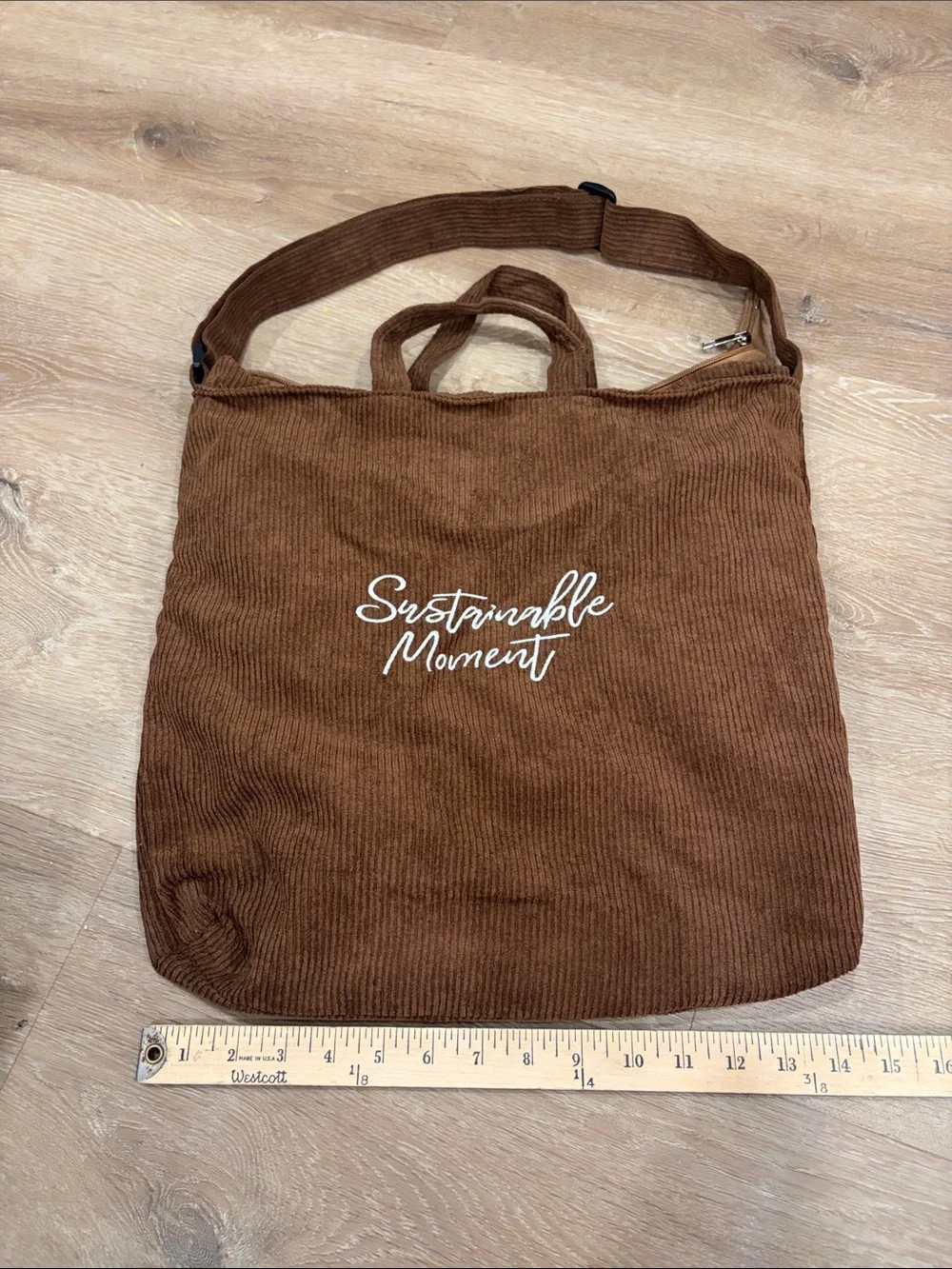 Urban Outfitters brown corduroy messenger tote with white logo